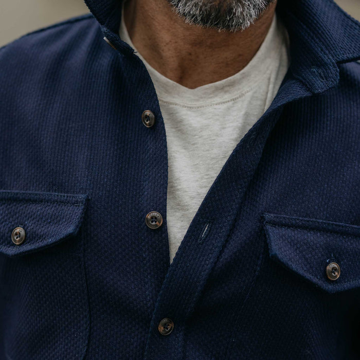 fit model showing off the buttons on The Mill Shirt Jacket in Rigid Indigo Sashiko