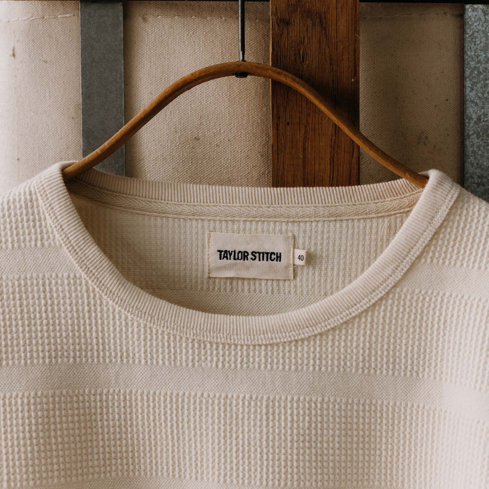 editorial image of The Morgan Crewneck in Natural Slub Stripe on a hanger