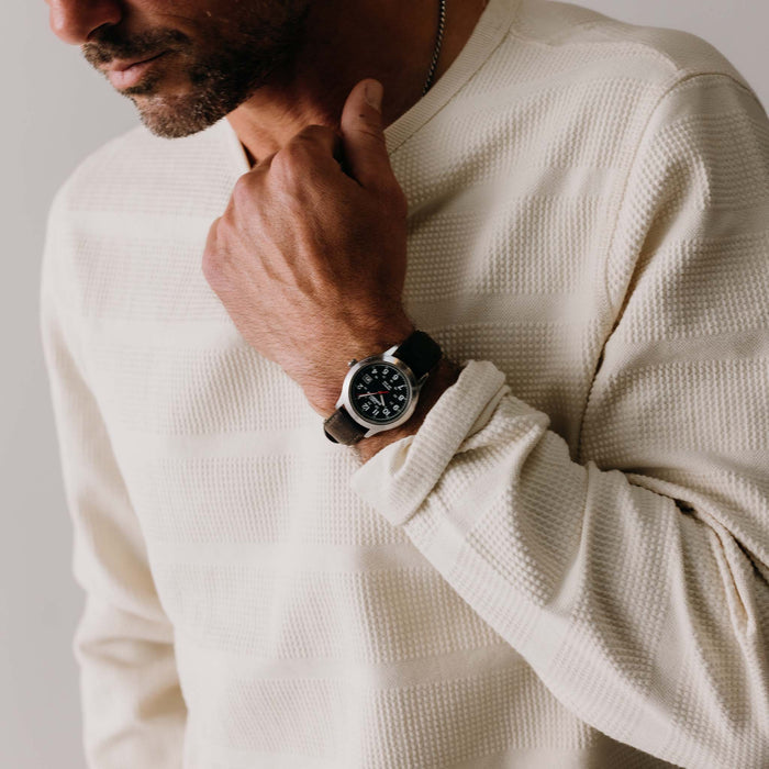fit model adjusting the collar on The Morgan Crewneck in Natural Slub Stripe