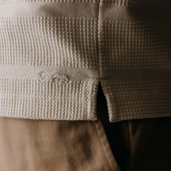 fit model showing off the texture and logo on The Morgan Crewneck in Natural Slub Stripe
