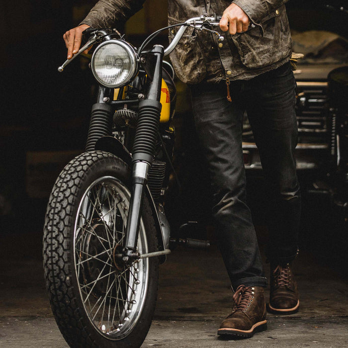 fit model walking in The Moto Boot in Espresso Grizzly