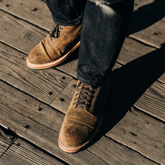 fit model wearing The Moto Boot in Golden Brown Waxed Suede
