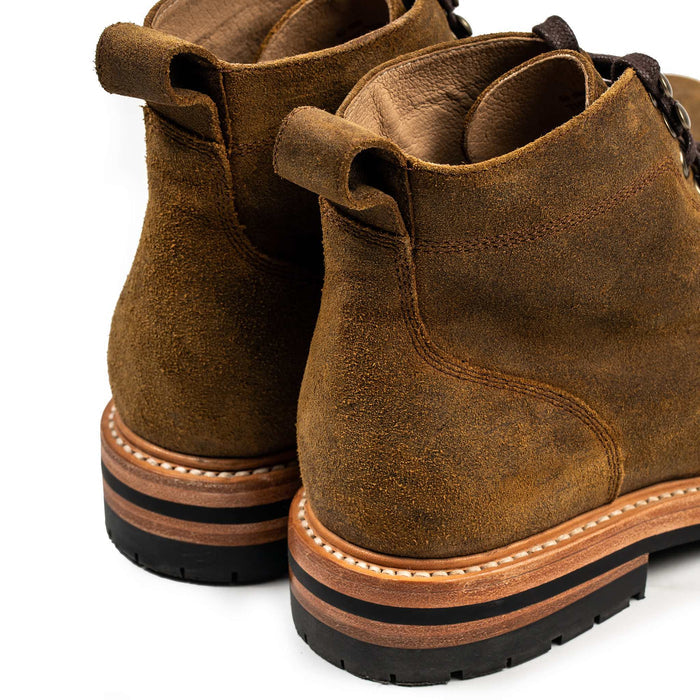 material shot of the back and pull tab of The Moto Boot in Golden Brown Waxed Suede