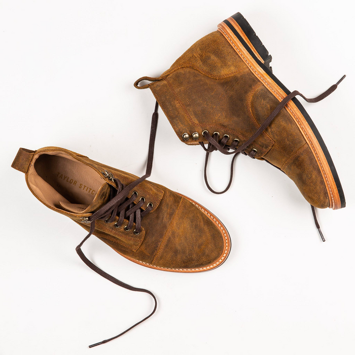 flatlay of The Moto Boot in Golden Brown Waxed Sued
