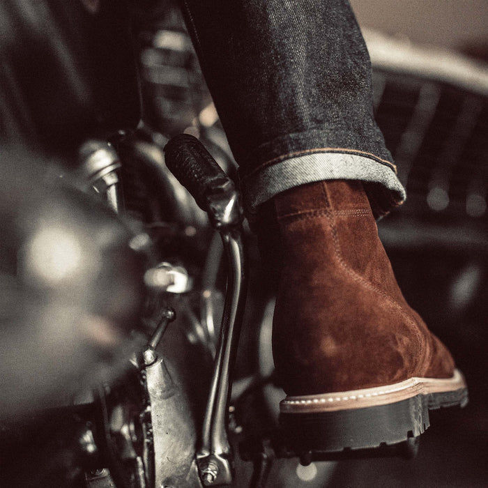 fit model showing off the back of The Moto Boot in Snuff Weatherproof Suede