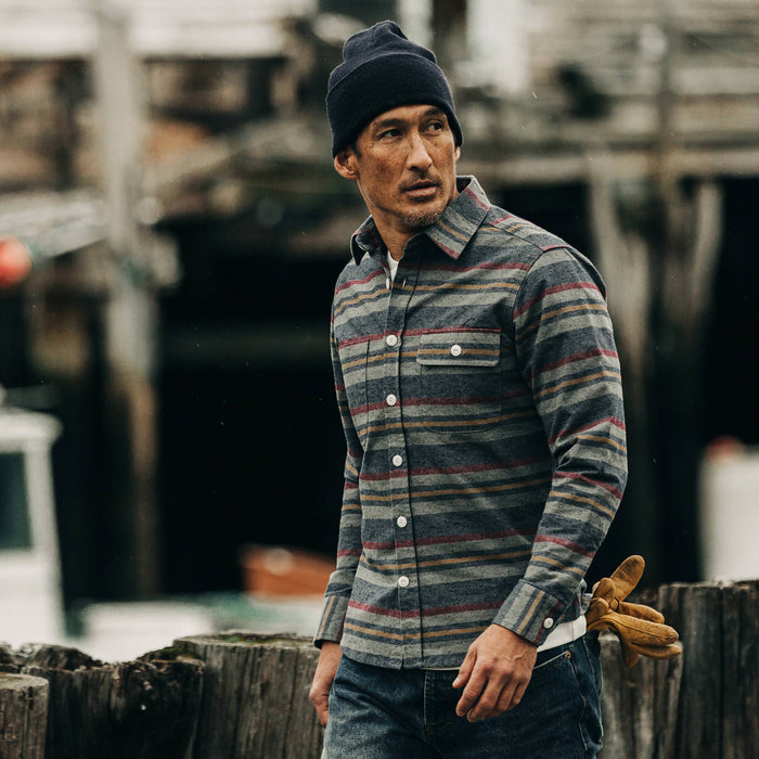 fit model rocking The Moto Shirt in Blanket Stripe, walking near dock