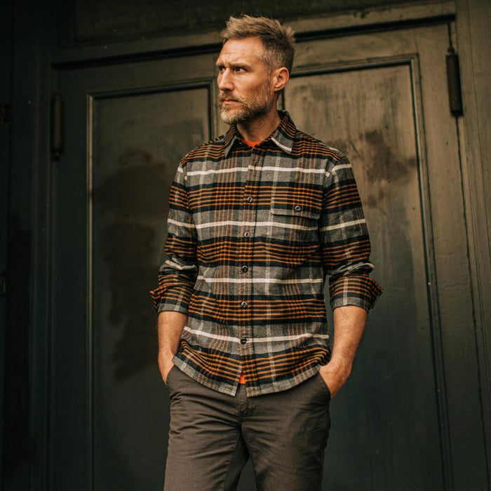 fit model wearing The Moto Shirt in Orange Plaid with sleeves rolled up