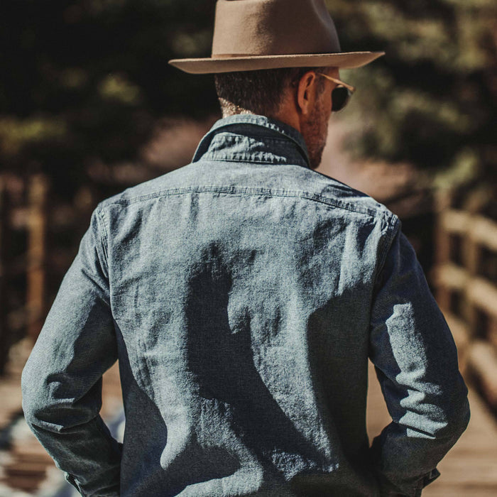our fit model wearing The Moto Utility Shirt in Indigo Pindot
