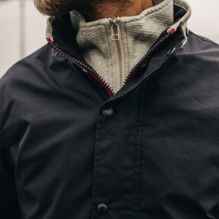 fit model wearing The Navigator Jacket in Natural and Navy Colorblock