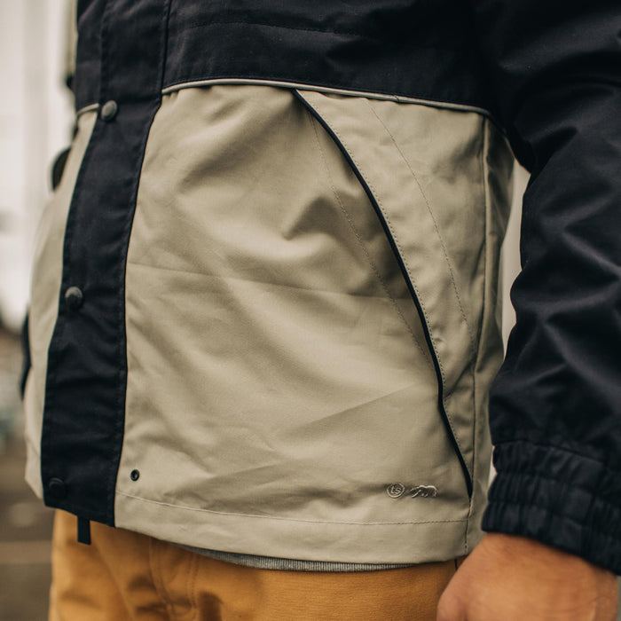 fit model wearing The Navigator Jacket in Natural and Navy Colorblock