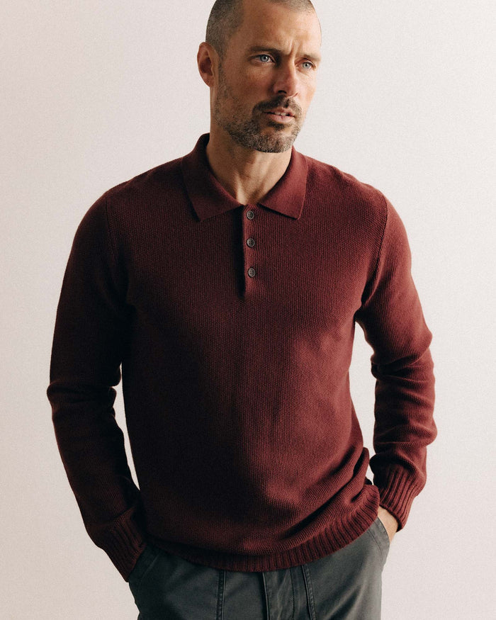 fit model posing in The Newton Sweater Polo in Dried Cherry Merino