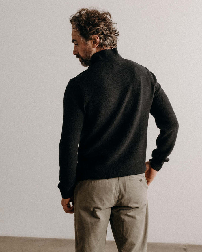 fit model showing off The Newton Sweater Polo in Midnight Merino
