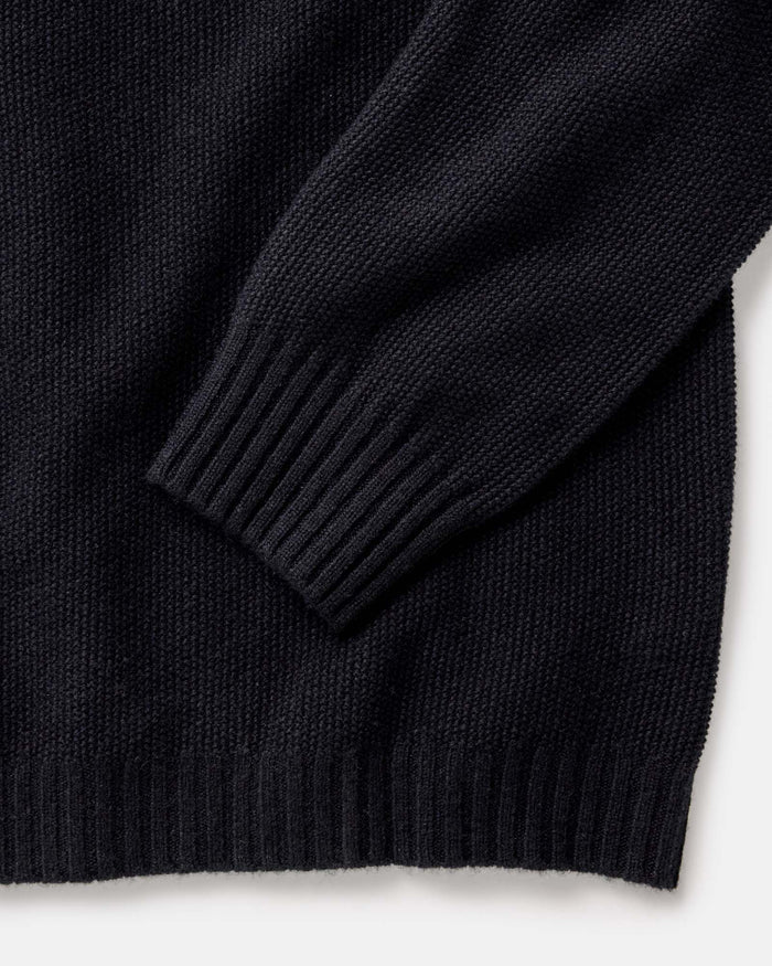 material shot of the sleeves on The Newton Sweater Polo in Midnight Merino