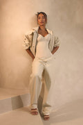 The Nyra Faux Leather Trousers in Off White