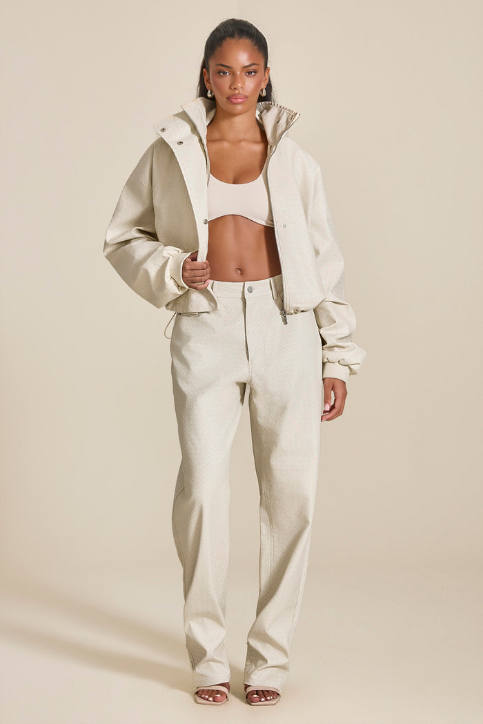 The Nyra Faux Leather Trousers in Off White