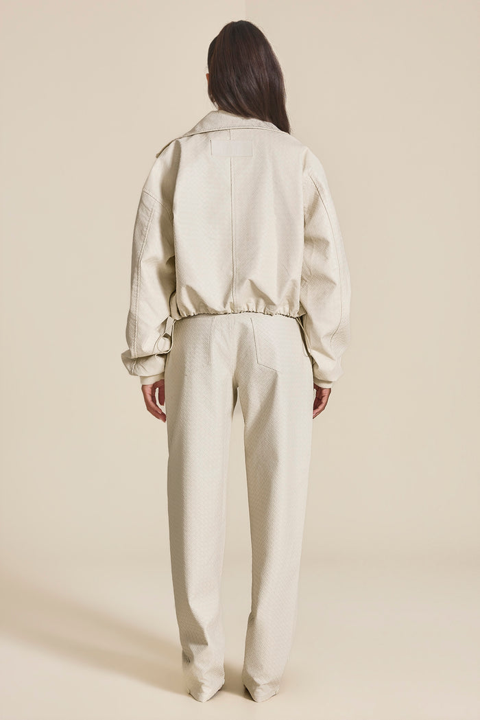 The Nyra Faux Leather Trousers in Off White