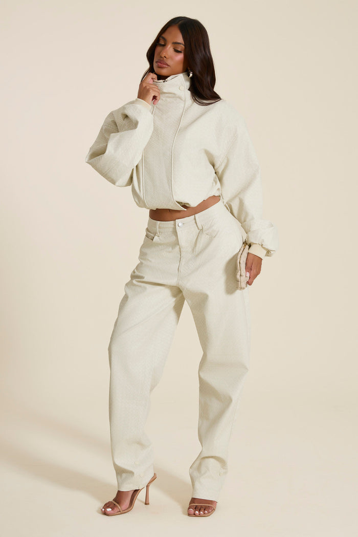 The Nyra Faux Leather Trousers in Off White