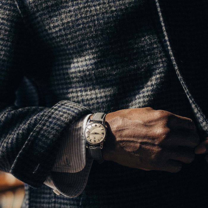 fit model showing the button cuffs on The Ojai Jacket in Ash Guncheck Wool
