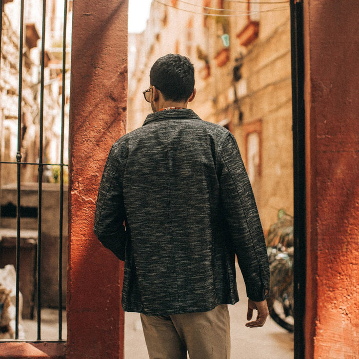fit model wearing The Ojai Jacket in Black Cross Dye, back shot