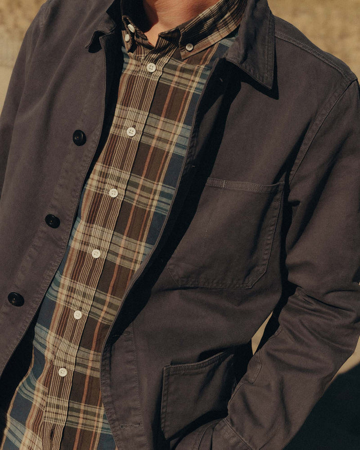 fit model walking in The Ojai Jacket in Organic Charcoal Foundation Twill