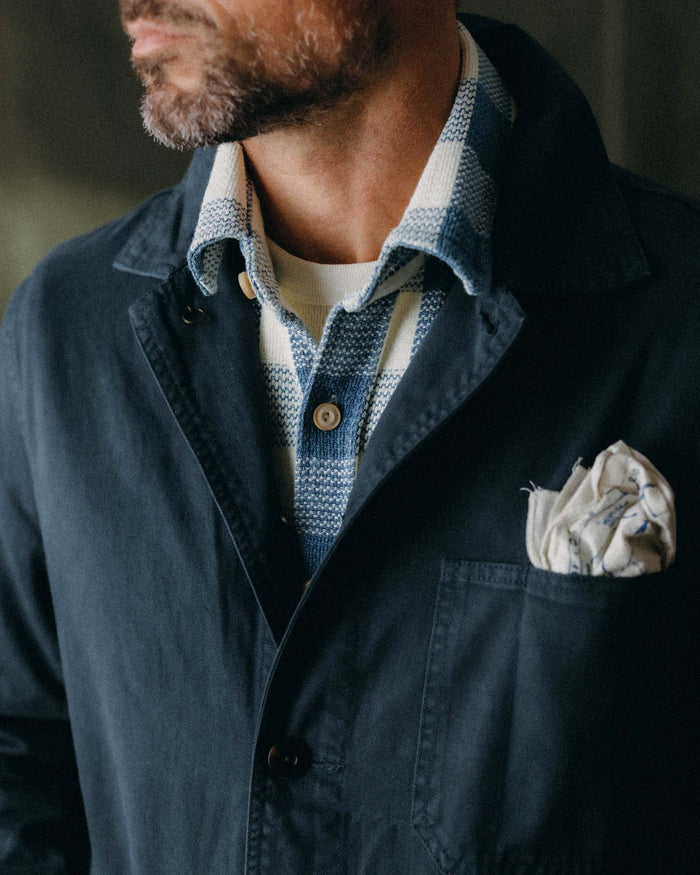 fit model buttoning the front of The Ojai Jacket in Organic Navy Foundation Twill