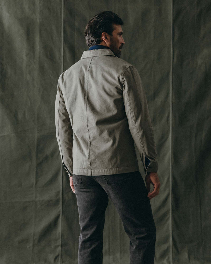 fit model buttoning up The Ojai Jacket in Organic Smoked Olive Foundation Twill