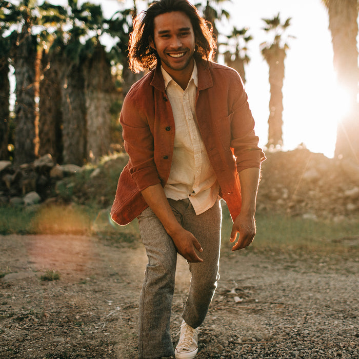 fit model walking in The Ojai Jacket in Rust Hemp