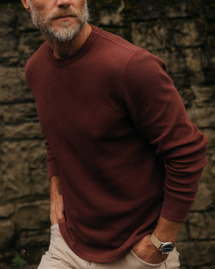 fit model with his hands in his pockets wearing The Organic Cotton Waffle Crew in Burgundy