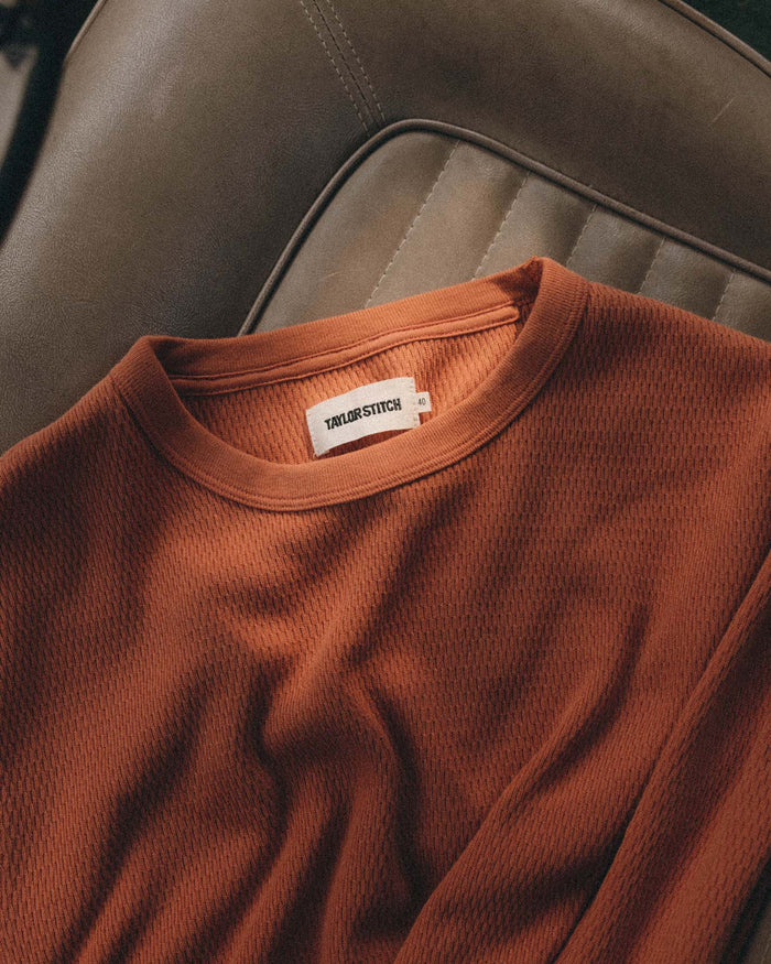 editorial flatlay of The Organic Cotton Crew in Summit Orange Waffle