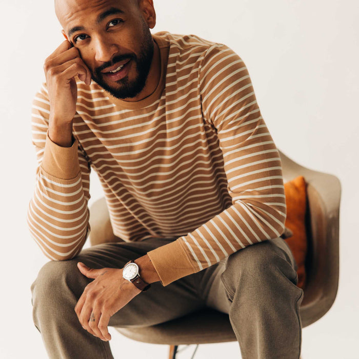fit model sitting in The Organic Cotton Long Sleeve Tee in Churro Stripe