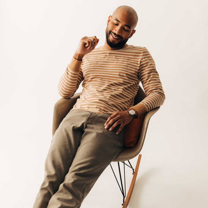 fit model sitting wearing The Organic Cotton Long Sleeve Tee in Churro Stripe