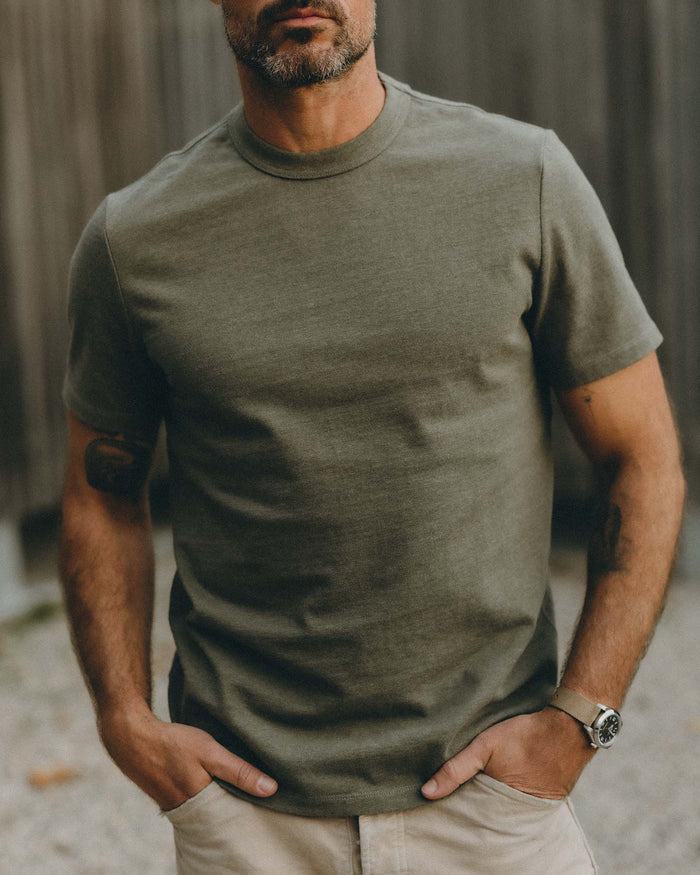 fit model posing wearing The Organic Cotton Shop Tee in Army Twist