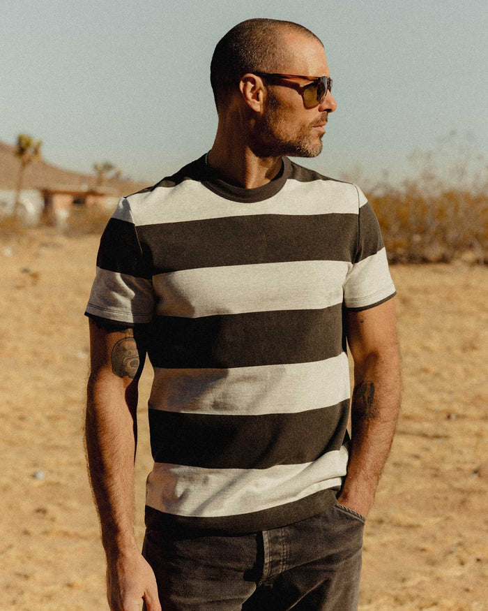 fit model posing in The Organic Cotton Shop Tee in Faded Black Stripe