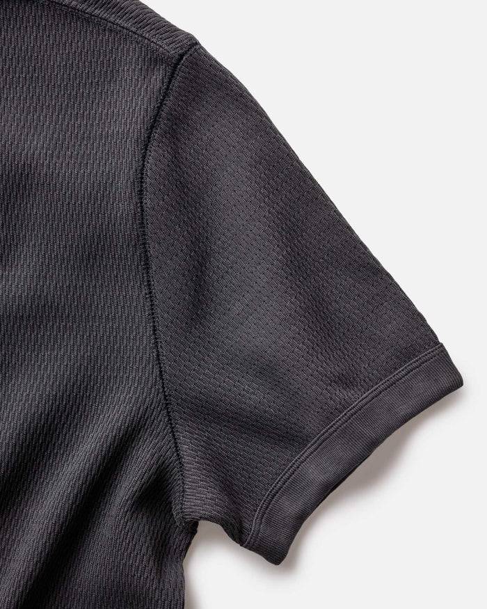 material shot of the sleeve of The Organic Cotton Short Sleeve Crew in Faded Black Waffle