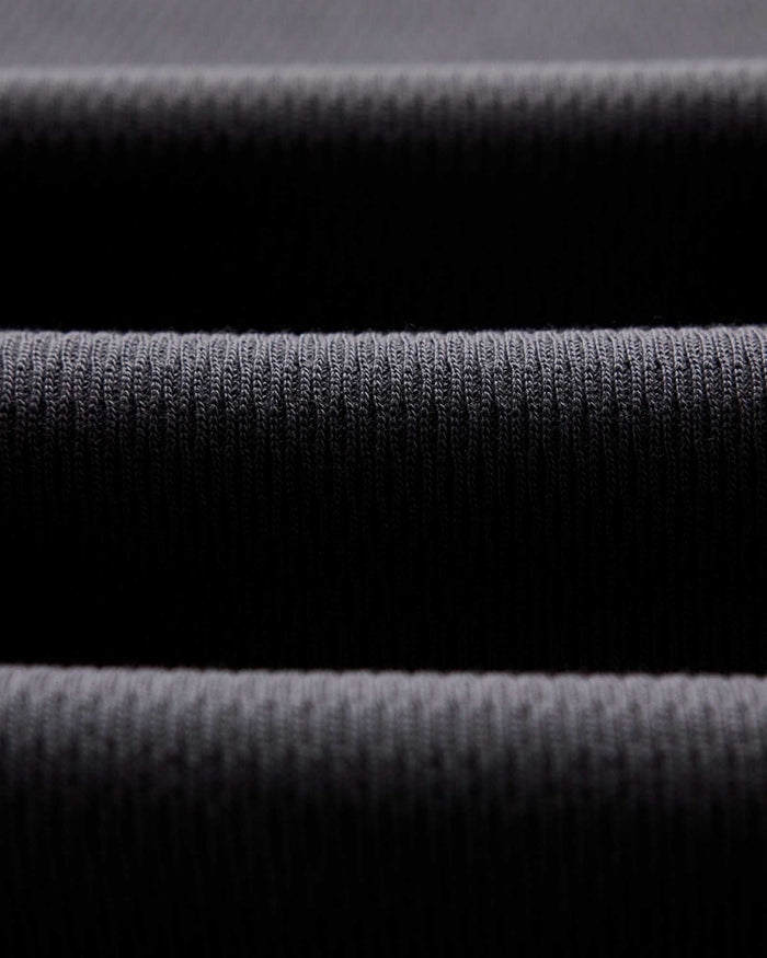 material shot of the waffle texture of The Organic Cotton Short Sleeve Crew in Faded Black Waffle