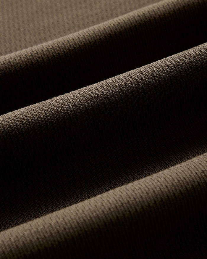 material shot of the waffle fabric on The Organic Cotton Short Sleeve Crew in Fatigue Olive Waffle