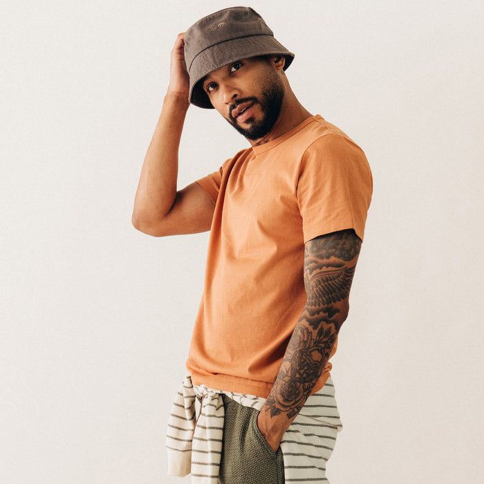 fit model showing off the side of The Organic Cotton Tee in Adobe