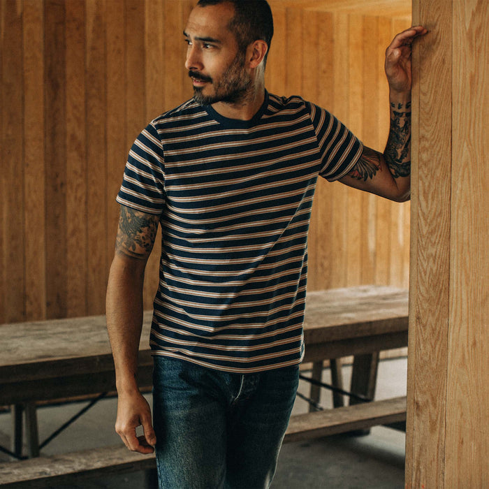 fit model posing wearing The Organic Cotton Tee in Deep Sea Stripe