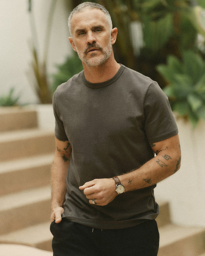 fit model in The Organic Cotton Tee in Faded Black