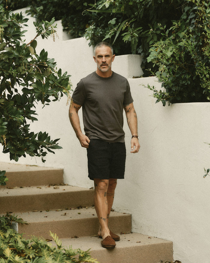 fit model posing in The Organic Cotton Tee in Faded Black
