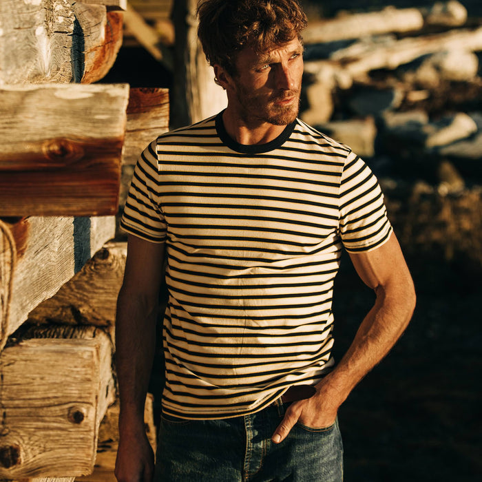 fit model wearing The Organic Cotton Tee in Gold Stripe, hand in pocket