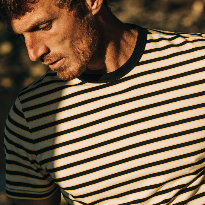 fit model wearing The Organic Cotton Tee in Gold Stripe, chest crop