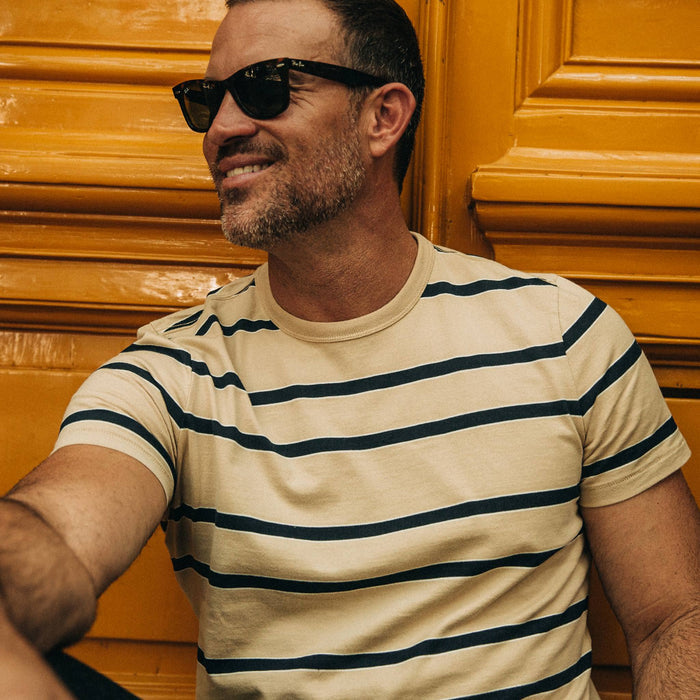 fit model wearing The Organic Cotton Tee in Khaki Stripe, cropped to chest