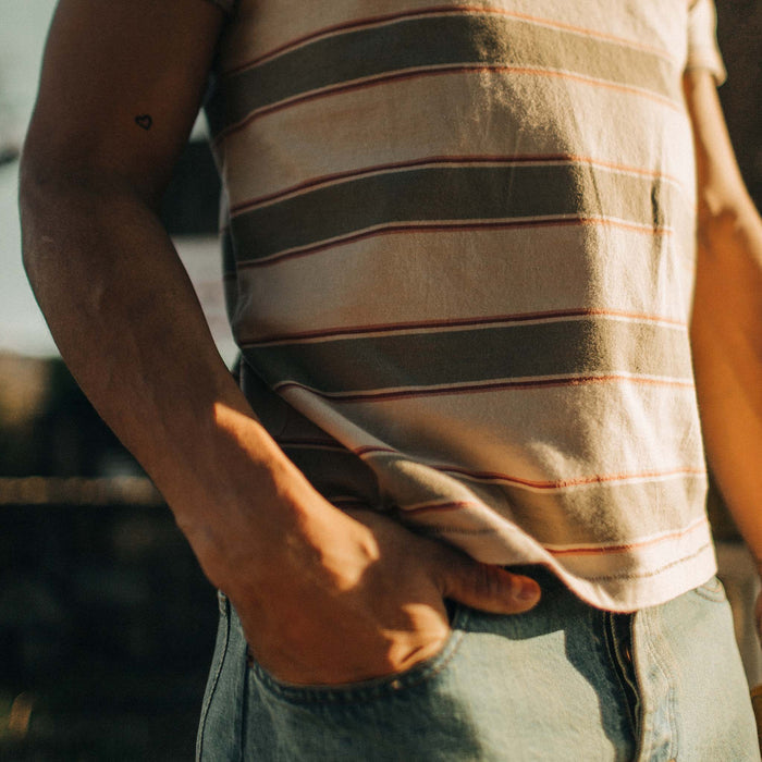 fit model standing in the sun in The Organic Cotton Tee in Seagrass Stripe