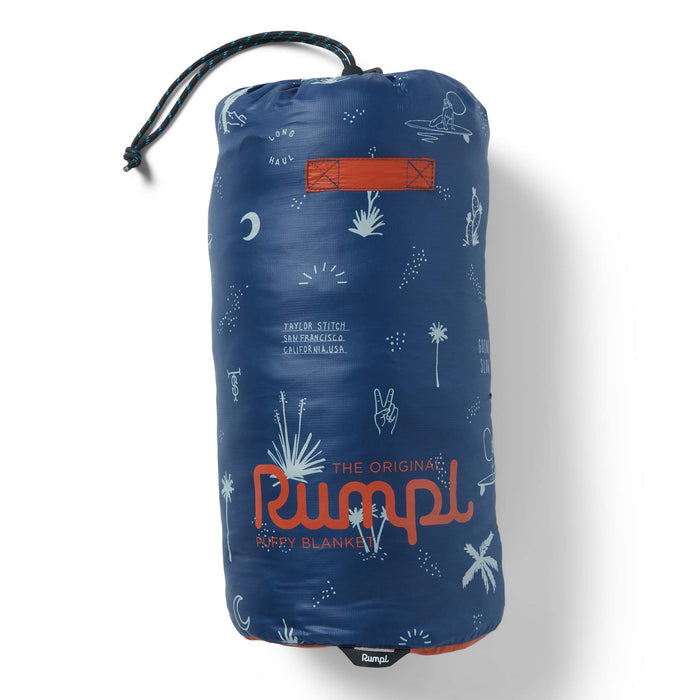 The Original Puffy Blanket in Navy Aloha in its bag