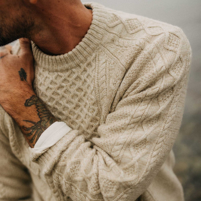 fit model showing off the texture on The Orr Sweater in Marled Oat Merino