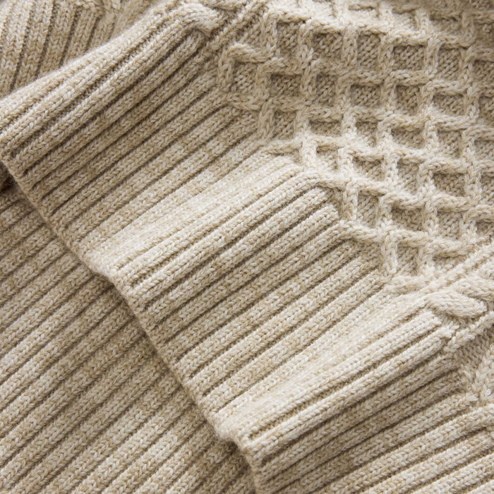 material shot of the hem on The Orr Sweater in Marled Oat Merino