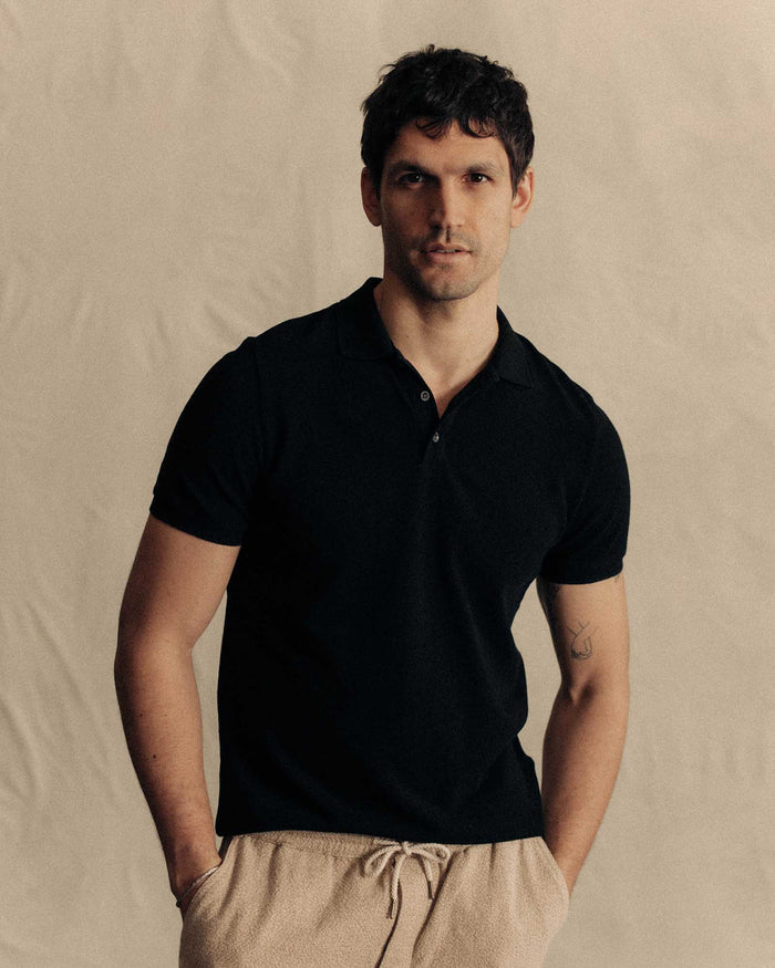 fit model posing in The Pacific Polo in Black Indigo Pique