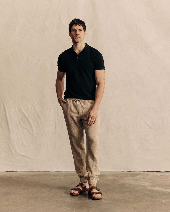 fit model standing wearing The Pacific Polo in Black Indigo Pique