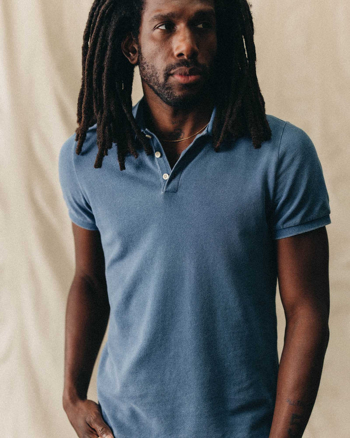 fit model showing off The Pacific Polo in Washed Indigo Pique